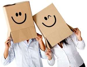 Couple of cardbord characters with smiley faces - isolated over a white background